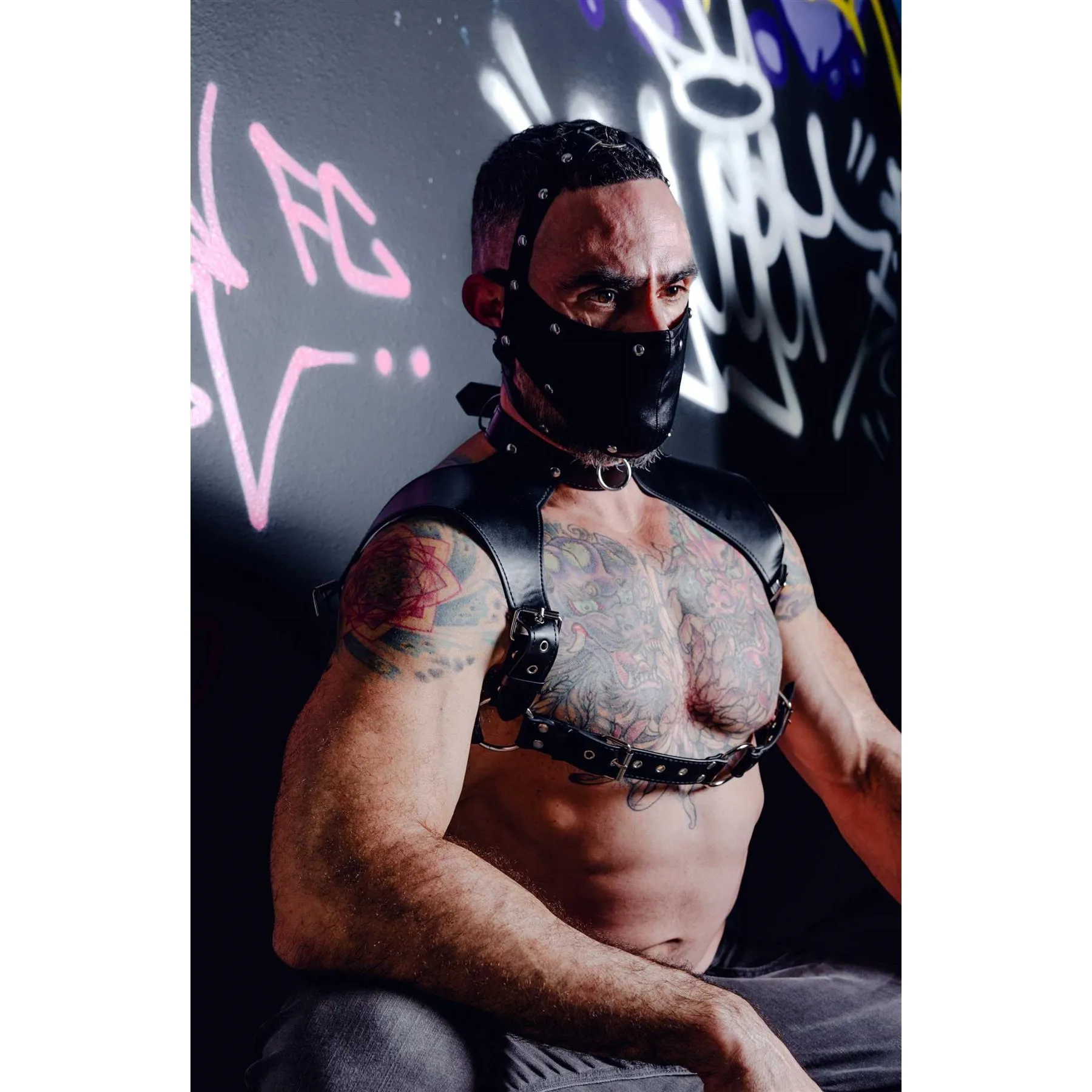 Masked Male posed wearing leather neck harness front view