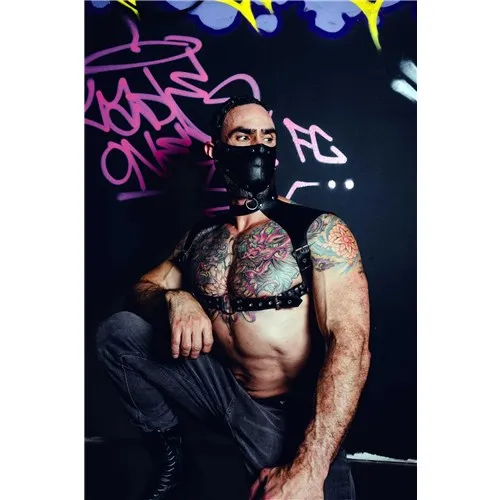 Masked Male posed wearing leather neck harness front view