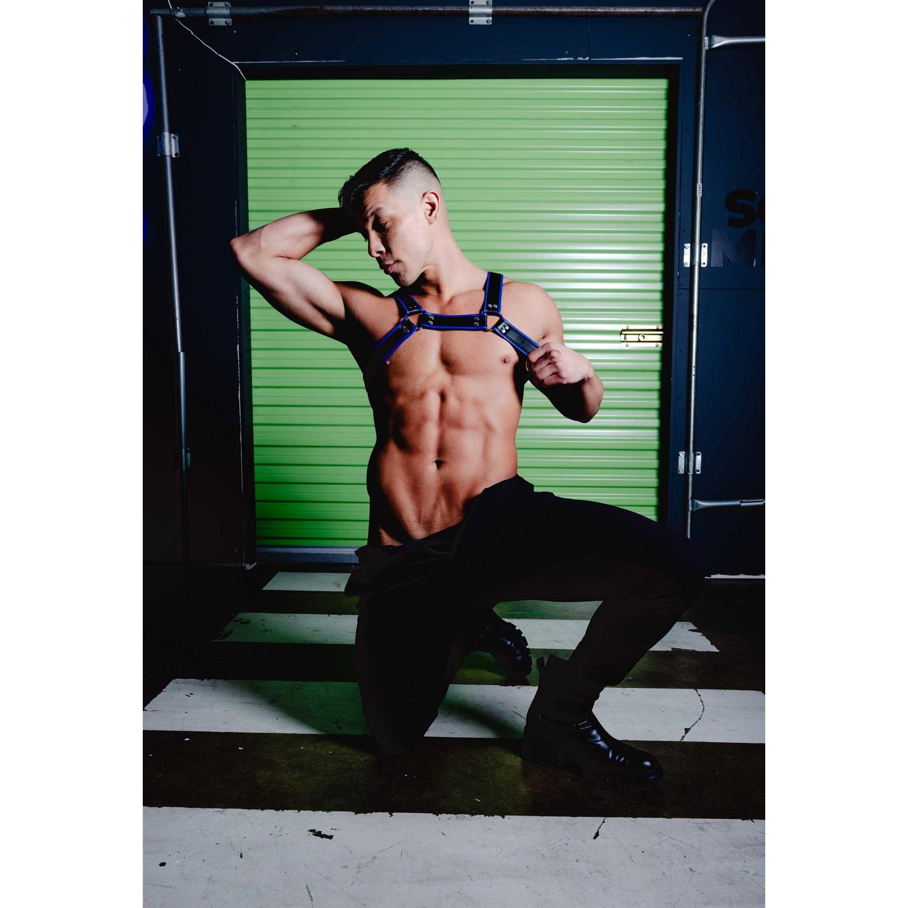 Male model posed wearing chest harness front view